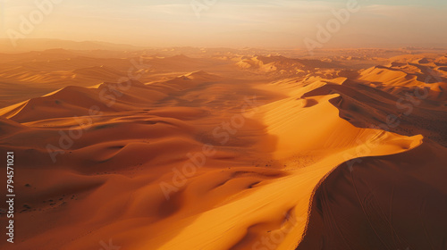 Colorful sunset over majestic sand dunes  vast desert aerial landscape with mountains in the background