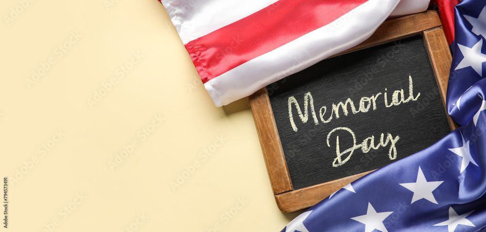Fototapeta premium Chalkboard with text MEMORIAL DAY and USA flag on light background