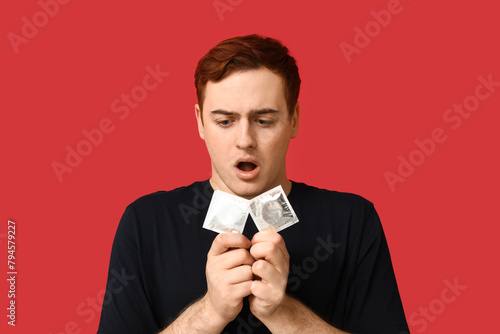Shocked young man with cond...