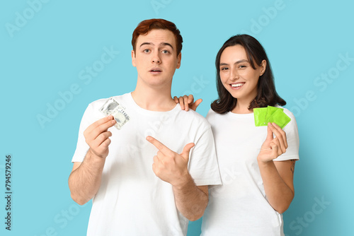 Young couple with condoms o...