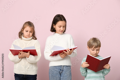 Little children reading boo...