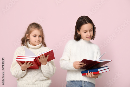 Little girls reading books ...