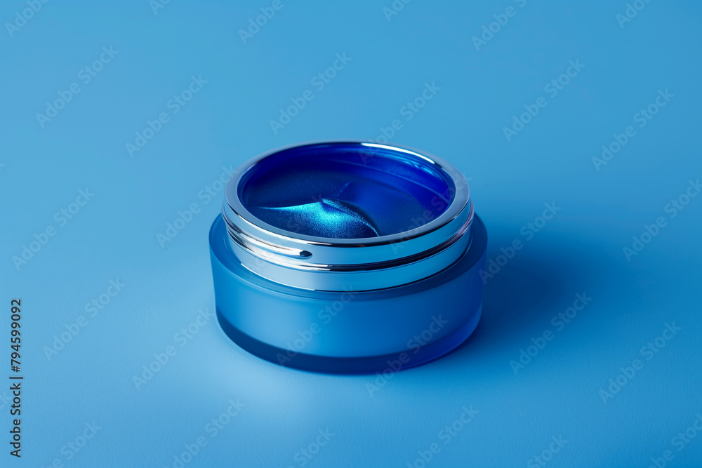 Blue cosmetic bottle for skincare on blue background. Moisturizing essential and serum concept Vitamin for health and beauty. Generated with AI Blue cosmetic bottle for skincare on blue background. Moisturizing essential and serum concept Vitamin for health and beauty. Generated with AI