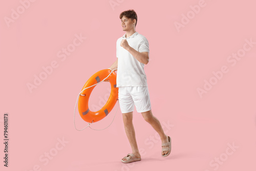 Male lifeguard with ring bu...