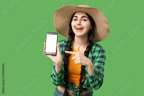 Young happy woman pointing ...