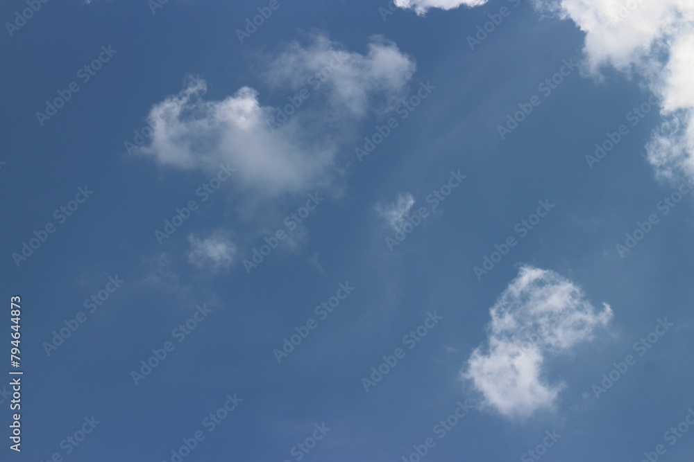 blue sky and white clouds. Freshness of the new day. Bright blue background. Relaxing feeling like being in the sky. blue sky and white clouds. Freshness of the new day. Bright blue background. Relaxing feeling like being in the sky.