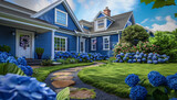 Royal blue Cape Cod style vacation home, with a front yard dotted with blue hydrangeas and a flagstone pathway.