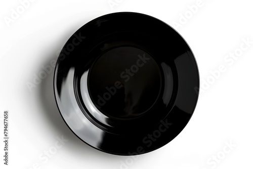 Empty black plate, top view isolated on white background