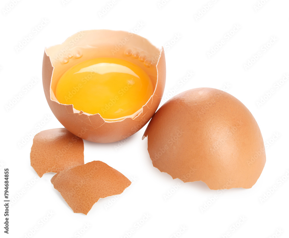 Cracked chicken egg with yolk isolated on white Cracked chicken egg with yolk isolated on white