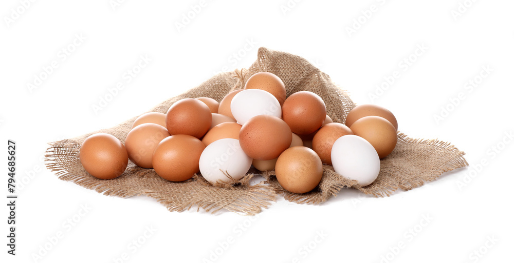 Fresh chicken eggs and burlap fabric isolated on white Fresh chicken eggs and burlap fabric isolated on white