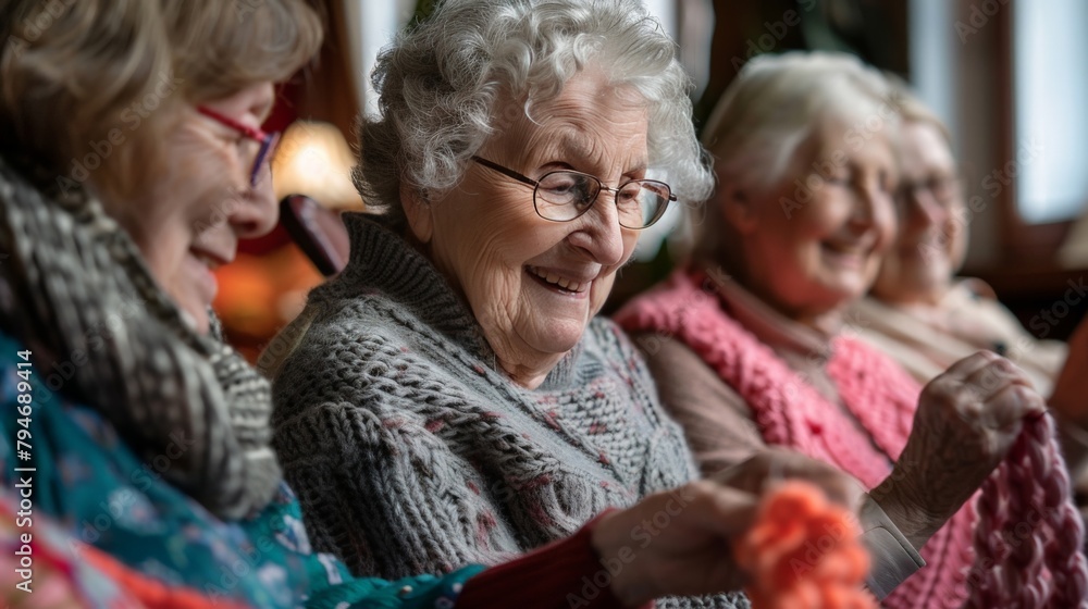 Senior women participating in a knitting circle, crafting and chatting Senior women participating in a knitting circle, crafting and chatting