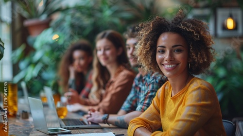 A diverse group of friends or colleagues gathered around a conference table engaged in a constructive discussion about the impact of cancel culture and online harassment photo