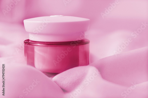 Mockup of cream jar. Packaging for cosmetics. Concept of skin care and advertising. Pink color