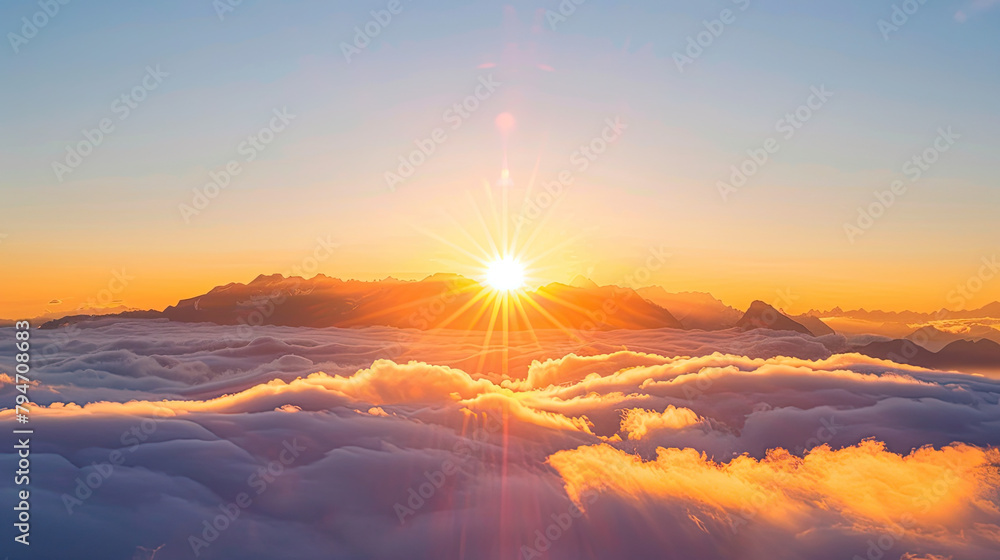 the sun is rising over clouds over the mountain