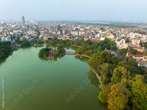Aerial drone top view of Hoan Kiem lake with Ngoc Son temple and The Huc bridge in Hanoi.