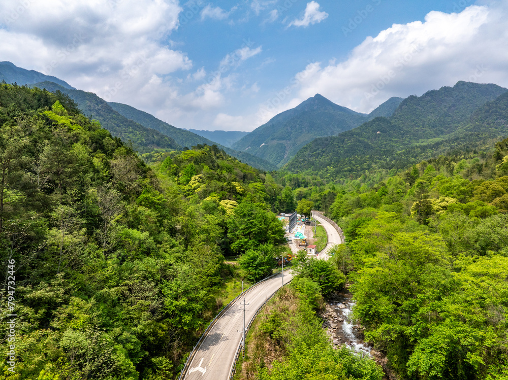 Aerial photography of the winding mountain road by the river Aerial photography of the winding mountain road by the river