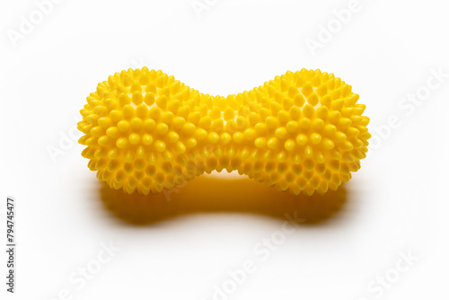 Plastic hand massager with spikes, for self-massage. Studio shot, isolated on white.