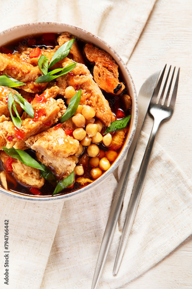 Soybean with soy meat, onion and tofu on light wooden background. Vegan food