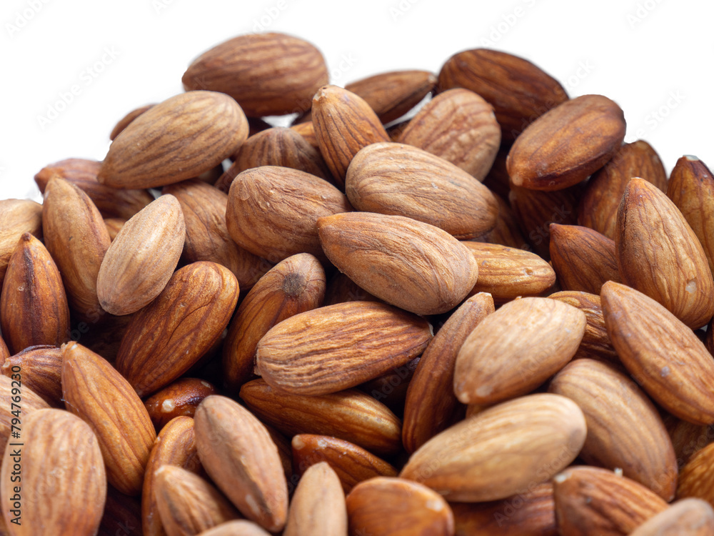 Almonds on a white background. Health benefits of almonds. Healthy nutrition and energy source 