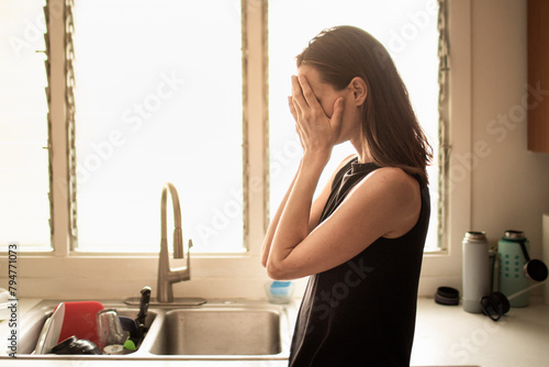 Woman in the kitchen feeling sad tired stressed overworked worried suffering depression mental health family problems © kieferpix