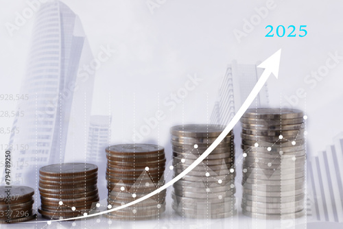 The value of money will increase in 2025. Saving money for real estate investment Stack of money on a tall building and a graph and arrows rising up.