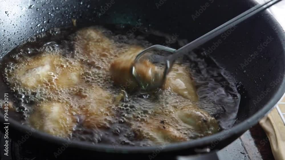 Fried chicken in a pan close up Fried chicken in a pan close up