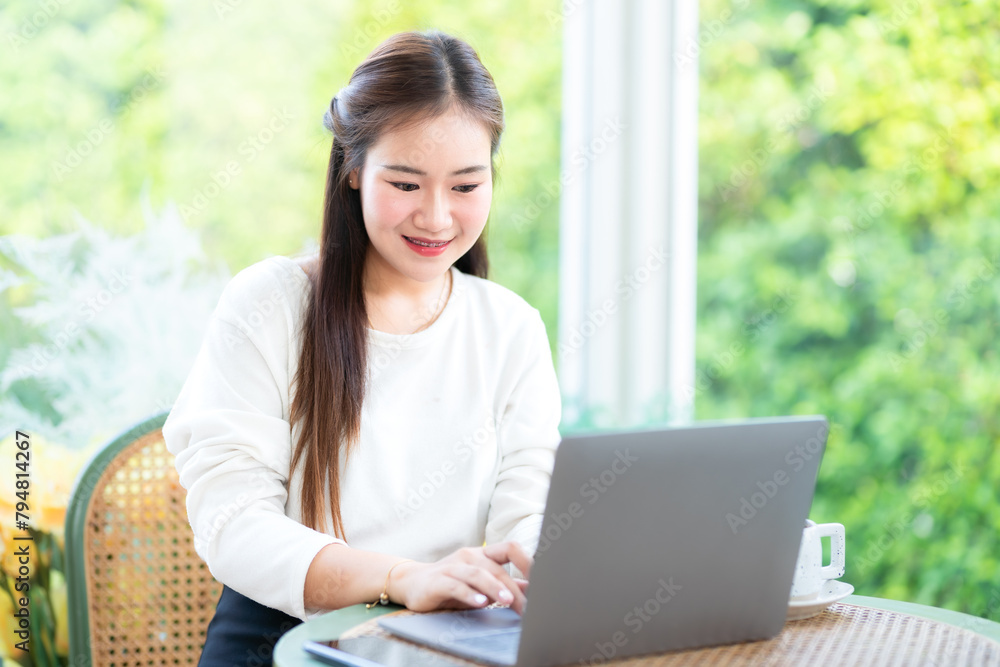 asian freelance people business female talking making using casual working with laptop computer for browsing internet, chatting and blogging and smartphone,notebook in coffee shop. asian freelance people business female talking making using casual working with laptop computer for browsing internet, chatting and blogging and smartphone,notebook in coffee shop.
