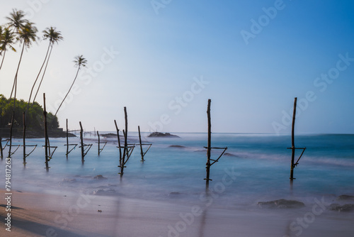 stilt fishing village in Sri Lanka long exposure