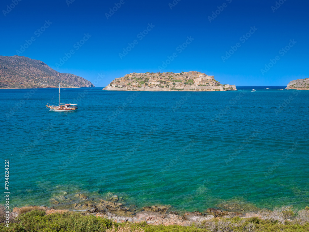 Spinalonga Island the ruins of an old Venetian fortress viewed from a viewpoint in a main land (Plaka , Crete, Greece)