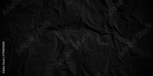 Dark black wrinkly backdrop paper background. panorama grunge wrinkly paper texture background, crumpled pattern texture. paper crumpled texture. black fabric crushed textured crumpled.