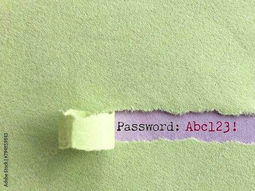 Password text behind torn paper background. Stock photo.