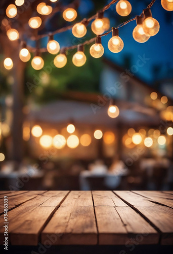Blurred background of restaurant with abstract bokeh light. Lights decoration Party Event Festival Holiday blur background. outdoor string lights