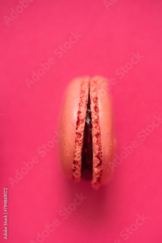 Macaroon on a pink background. Close-up. Top view.