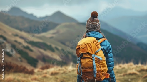 Lifestyle image of a young woman hiking in the mountains