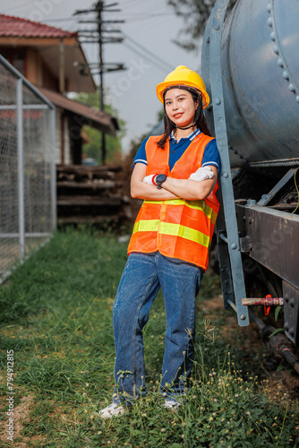 portrait train locomotive engineer women worker. Happy Asian young teen smiling work at train station train track locomotive service maintenance.