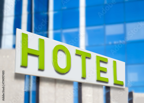 Hotel word with green letters on hotel at city © cunaplus