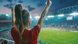 female fans celebrating victory in soccer stadium.