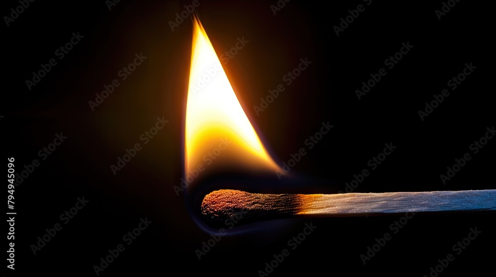 A closeup of the flame from an unlit match, the glow reflecting on its tip, against a black background. A closeup of the flame from an unlit match, the glow reflecting on its tip, against a black background.