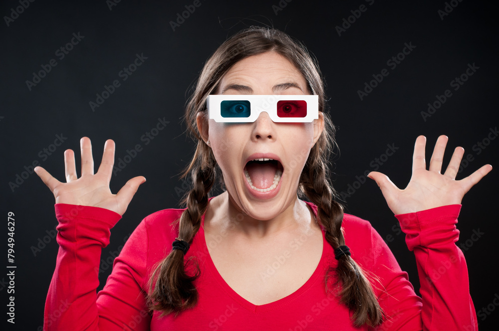 Surprise, portrait and woman with 3d glasses for movie, film and theater on dark background. Wow, scream and face of student in expression for shock in futuristic eyewear by studio backdrop Surprise, portrait and woman with 3d glasses for movie, film and theater on dark background. Wow, scream and face of student in expression for shock in futuristic eyewear by studio backdrop
