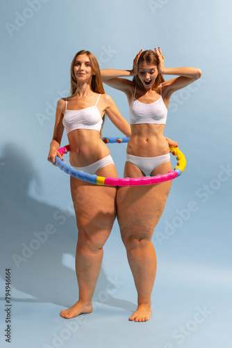 Positive body transformation. Fit, muscular female upper body and fat legs with cellulite. Conceptual design. Importance of physical activity and wellness. Concept of weight-loss, sport, dieting photo