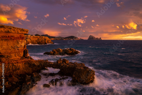 Beautiful sunset at Cap des Bou cape, near Cala Comte beaches, Sant Josep de Sa Talaia, Ibiza, Balearic Islands, Spain photo