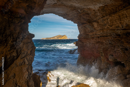 View of S Espartar islet from Sa Figuera cave, Cap des Bou cape, San Josep de Sa Talaia, Ibiza, Balearic Islands, Spain photo