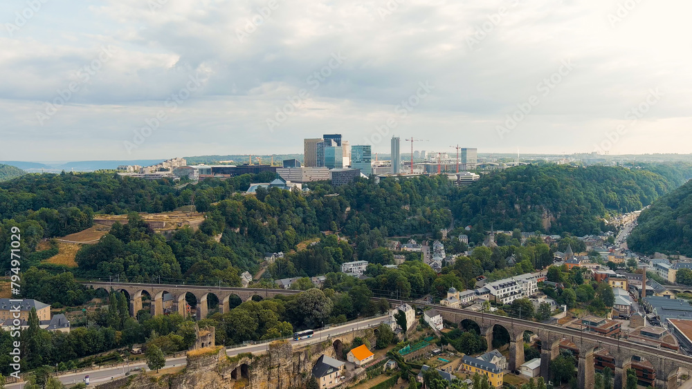 Luxembourg City, Luxembourg. Railway with bridges and arches. View of the Kirchberg area with modern houses, Aerial View