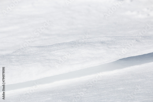 Close up of thin ledge of windswept sparkling snow
