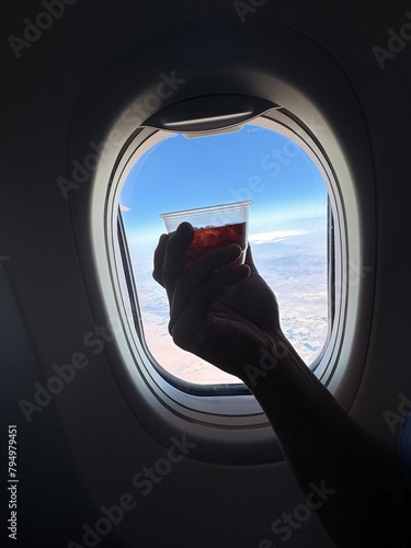 Enjoying a beverage on a flight