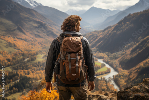 A man travels in the mountains with a backpack.