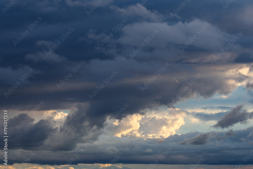 storm clouds illuminated by sunlight storm clouds illuminated by sunlight