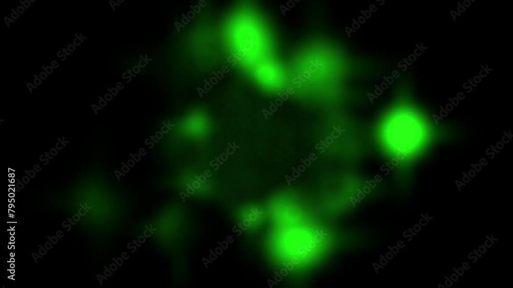 Green glowing spots on a black background Green glowing spots on a black background