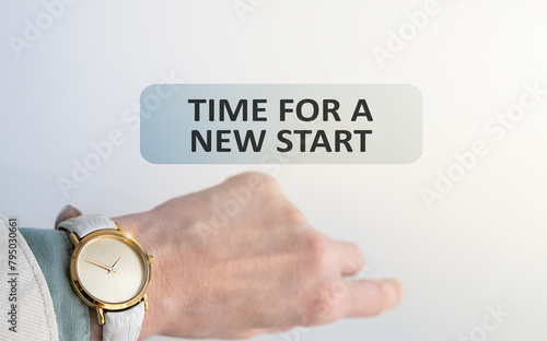 Wristwatch on a woman's hand, time does not matter, girl with a watch and the inscription Time For a New Start