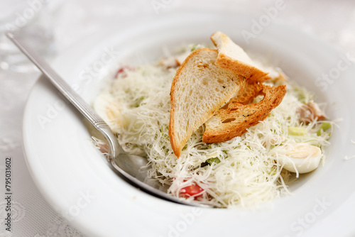 Caesar salad with cheese and croutons